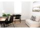 Bright office space with desk, chair, and comfortable white sofa seating at 2324 E Marguerite Ave, Phoenix, AZ 85040