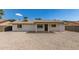 Exterior of home shows covered patio and rock landscaping at 2348 E Diamond Ave, Mesa, AZ 85204