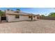 Back of house with covered patio and low maintenance rock yard at 2348 E Diamond Ave, Mesa, AZ 85204