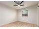 Inviting bedroom with neutral walls, wood-look floors and modern ceiling fan at 2348 E Diamond Ave, Mesa, AZ 85204
