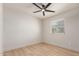 Minimalist bedroom featuring light-colored wood-look floors and a ceiling fan at 2348 E Diamond Ave, Mesa, AZ 85204