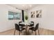 Cozy dining area with a modern light fixture and seating for four people at 2348 E Diamond Ave, Mesa, AZ 85204