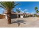 Attractive single-story home with desert landscaping, complemented by a two-car garage and shade trees at 2348 E Diamond Ave, Mesa, AZ 85204