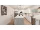 Bright, modern kitchen features white cabinets, quartz countertops, and stainless steel appliances at 2348 E Diamond Ave, Mesa, AZ 85204