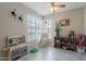 Bright playroom with natural light, a play kitchen, and educational toys at 2455 E Broadway Rd # 115, Mesa, AZ 85204