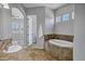 Bathroom featuring a large tub, vanity, and doorway to another room at 24615 S 182Nd Pl, Gilbert, AZ 85298