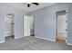 A neutral colored bedroom featuring an attached bathroom and a large closet for extra storage at 24615 S 182Nd Pl, Gilbert, AZ 85298