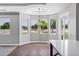 Bright breakfast nook features wood-look tile floors, lots of windows, and a modern chandelier at 24615 S 182Nd Pl, Gilbert, AZ 85298