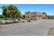Spacious driveway leading to a well-maintained home with mature trees at 24615 S 182Nd Pl, Gilbert, AZ 85298