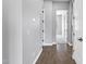 Hallway featuring wood flooring and doors to various rooms creating an inviting transition space at 24615 S 182Nd Pl, Gilbert, AZ 85298