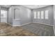 Neutral living room offering plantation shutters and beautiful flooring at 24615 S 182Nd Pl, Gilbert, AZ 85298