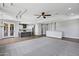 The open concept living room with ceiling fan, recessed lights and neutral paint colors connect to the kitchen at 24615 S 182Nd Pl, Gilbert, AZ 85298