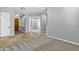 Open living space with carpet and travertine floors connecting various rooms at 24615 S 182Nd Pl, Gilbert, AZ 85298