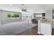Spacious living room connects to kitchen with large windows offering ample light and a view to the outdoors at 24615 S 182Nd Pl, Gilbert, AZ 85298
