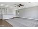 Bright living room features tile and carpet flooring, recessed lighting, a ceiling fan and neutral paint at 24615 S 182Nd Pl, Gilbert, AZ 85298