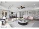 Spacious living room showcasing an open floor plan, modern decor, and a tray ceiling at 24615 S 182Nd Pl, Gilbert, AZ 85298