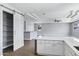 Open concept kitchen featuring white cabinets and a gray island, overlooking the Gathering room at 24615 S 182Nd Pl, Gilbert, AZ 85298