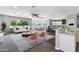 Open-concept living space featuring modern furnishings, ample natural light, and a stylish kitchen at 24615 S 182Nd Pl, Gilbert, AZ 85298