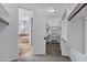 Walk-in closet leading to bathroom with a large tub at 24615 S 182Nd Pl, Gilbert, AZ 85298