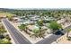 Stunning aerial view of a neighborhood highlighting a private pool with lush landscaping at 28 E Winged Foot Rd, Phoenix, AZ 85022