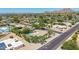 Expansive aerial view of desert landscaping and a private pool in a desirable neighborhood with mountain views at 28 E Winged Foot Rd, Phoenix, AZ 85022