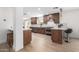 Gourmet kitchen boasts stainless steel appliances, white quartz countertops and wooden cabinets at 28 E Winged Foot Rd, Phoenix, AZ 85022