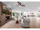 Spacious living room with hardwood floors, fireplace, and comfortable seating at 28 E Winged Foot Rd, Phoenix, AZ 85022