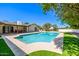 Beautiful pool and backyard with a manicured lawn and a covered patio attached to the home at 28 E Winged Foot Rd, Phoenix, AZ 85022