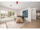 Bright sitting area with plantation shutters and comfortable seating at 28 E Winged Foot Rd, Phoenix, AZ 85022