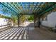 Trellis structure in backyard featuring desert landscaping with stone walkway at 28 E Winged Foot Rd, Phoenix, AZ 85022