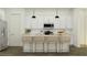 Bright kitchen features a large center island with seating and stainless steel appliances at 3006 E Lucky Horseshoe Ln, San Tan Valley, AZ 85140