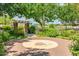 Decorative brick patio with an intricate leaf design set within a lush community park at 3085 E Camellia Dr, Gilbert, AZ 85296
