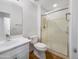 Bathroom with sleek, modern shower and sink, plus a white vanity at 31670 N Desert Willow Rd, San Tan Valley, AZ 85143