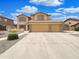 Charming two-story home boasts a three-car garage and manicured landscaping at 31670 N Desert Willow Rd, San Tan Valley, AZ 85143