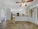 Open concept kitchen with stainless appliances and breakfast bar, flowing into dining area at 31670 N Desert Willow Rd, San Tan Valley, AZ 85143
