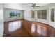 Spacious living room with hardwood floors and large windows allowing natural light at 31670 N Desert Willow Rd, San Tan Valley, AZ 85143