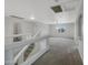 Spacious living room featuring neutral carpet, a ceiling fan, and large windows for plenty of natural light at 31670 N Desert Willow Rd, San Tan Valley, AZ 85143