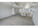 Upstairs loft space with carpeted floors and plenty of natural light from nearby windows at 31670 N Desert Willow Rd, San Tan Valley, AZ 85143