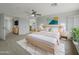 Serene main bedroom includes a ceiling fan, neutral color palette and ample space at 31670 N Desert Willow Rd, San Tan Valley, AZ 85143