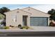 Charming single-story home with a two-car garage, desert landscaping, and a welcoming front entrance at 3352 E Ellie Trl, San Tan Valley, AZ 85143