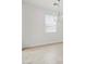 Well-lit bedroom featuring tile flooring and a modern light fixture at 3529 E Audrey Dr, San Tan Valley, AZ 85143