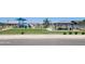 A well-maintained park features green grass, playground equipment, and shaded picnic spots at 3529 E Audrey Dr, San Tan Valley, AZ 85143