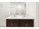 Bathroom featuring double sinks, a large mirror, and tiled flooring, perfect for modern living at 3557 E Audrey Dr, San Tan Valley, AZ 85143