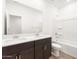 Bright bathroom with a double vanity, large mirror, and shower-tub combination at 3557 E Audrey Dr, San Tan Valley, AZ 85143