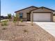 Inviting single-story house with a two-car garage and low-maintenance desert landscaping at 3557 E Audrey Dr, San Tan Valley, AZ 85143