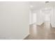 Bright hallway with tile flooring leading to various rooms at 3557 E Audrey Dr, San Tan Valley, AZ 85143