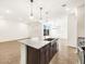 A kitchen with granite countertops, an island with a sink and stainless steel appliances at 3557 E Audrey Dr, San Tan Valley, AZ 85143