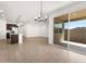 Open floor plan featuring tiled living space with kitchen and patio access at 3557 E Audrey Dr, San Tan Valley, AZ 85143