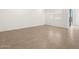 Large living area featuring tiled floors, natural light, and neutral walls at 3557 E Audrey Dr, San Tan Valley, AZ 85143