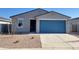 Charming single-story home featuring a blue garage door, low-maintenance landscaping, and modern design elements at 3660 E Audrey Dr, San Tan Valley, AZ 85143